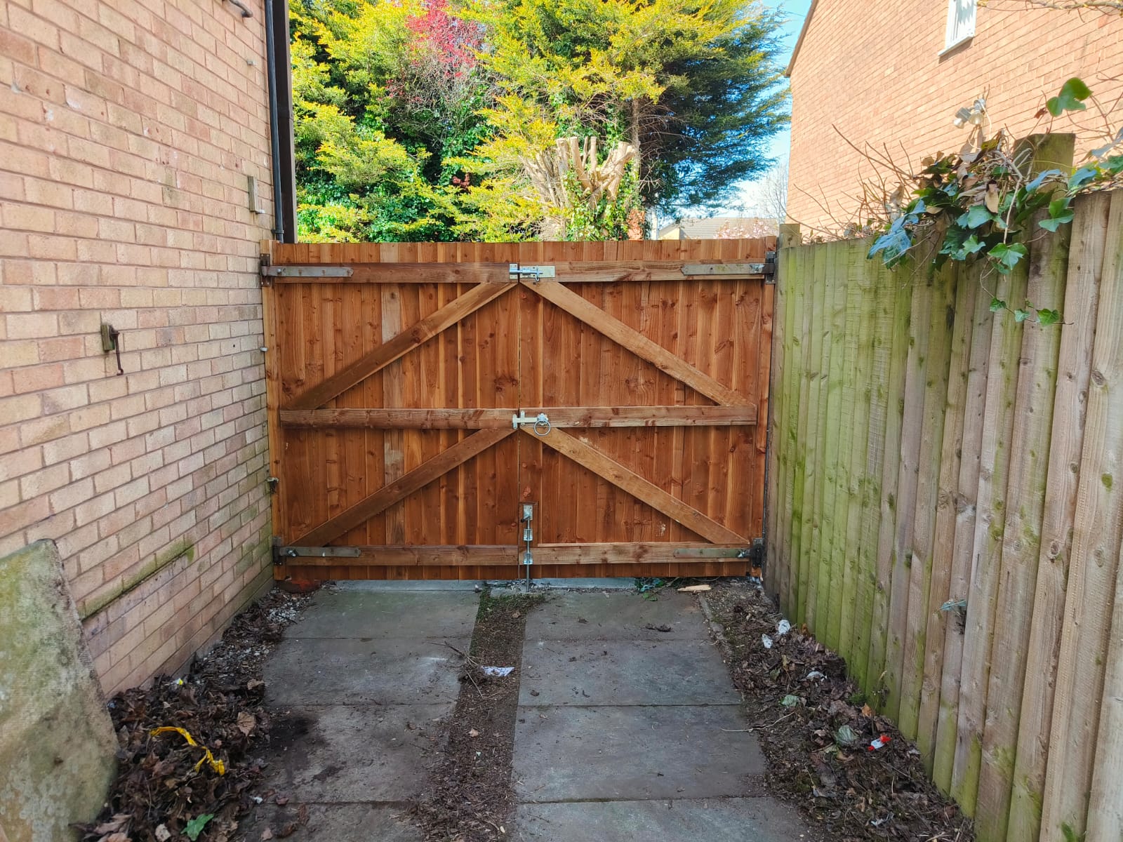New metal access gate fitted to a communal pathway